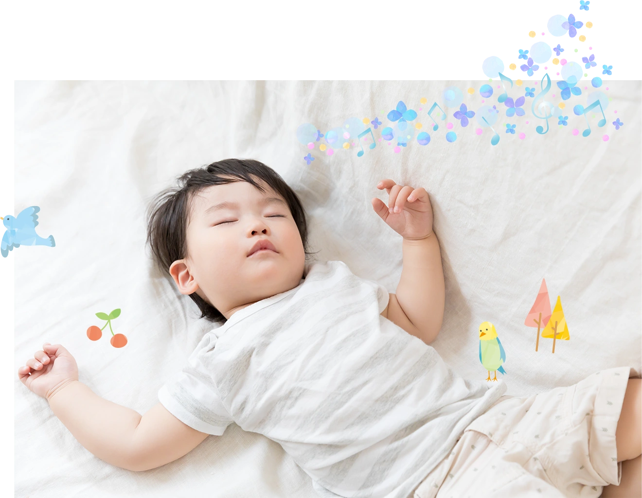 ベッドで気持ちよさそうに眠るお子様